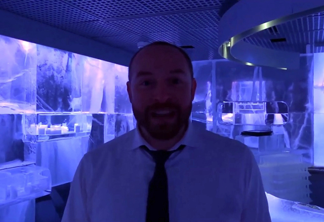 A screenshot showing a man in blue light