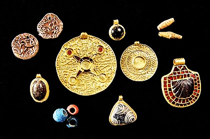 golden jewellery on a black background