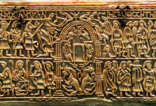 carved tablet showing people with spears and weapons