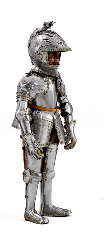Polished boy size armour and peaked helmet embossed with a serpent like monster's head.